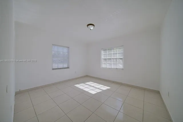 a view of an empty room and window