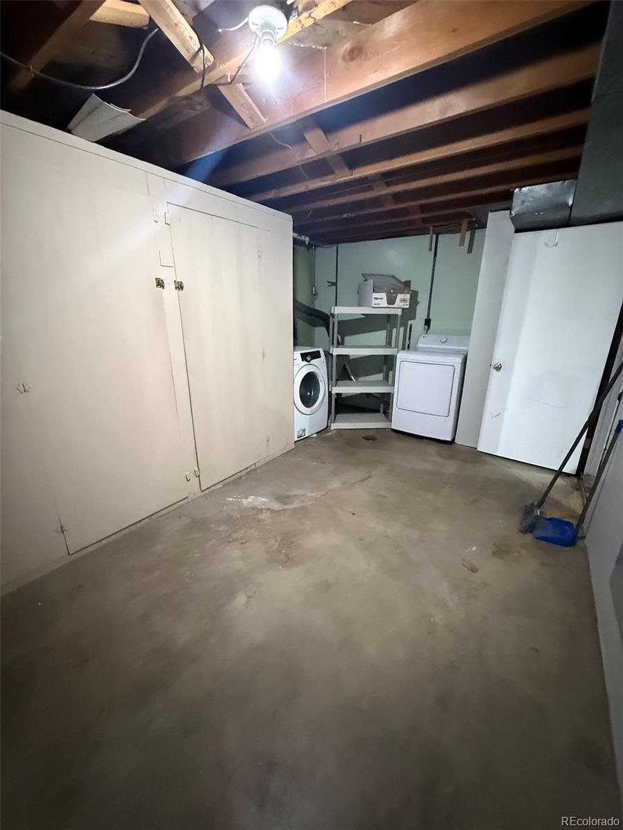 378 South Racine Street Aurora, CO 80012 - Photo 23 of 44 a view of a garage with storage