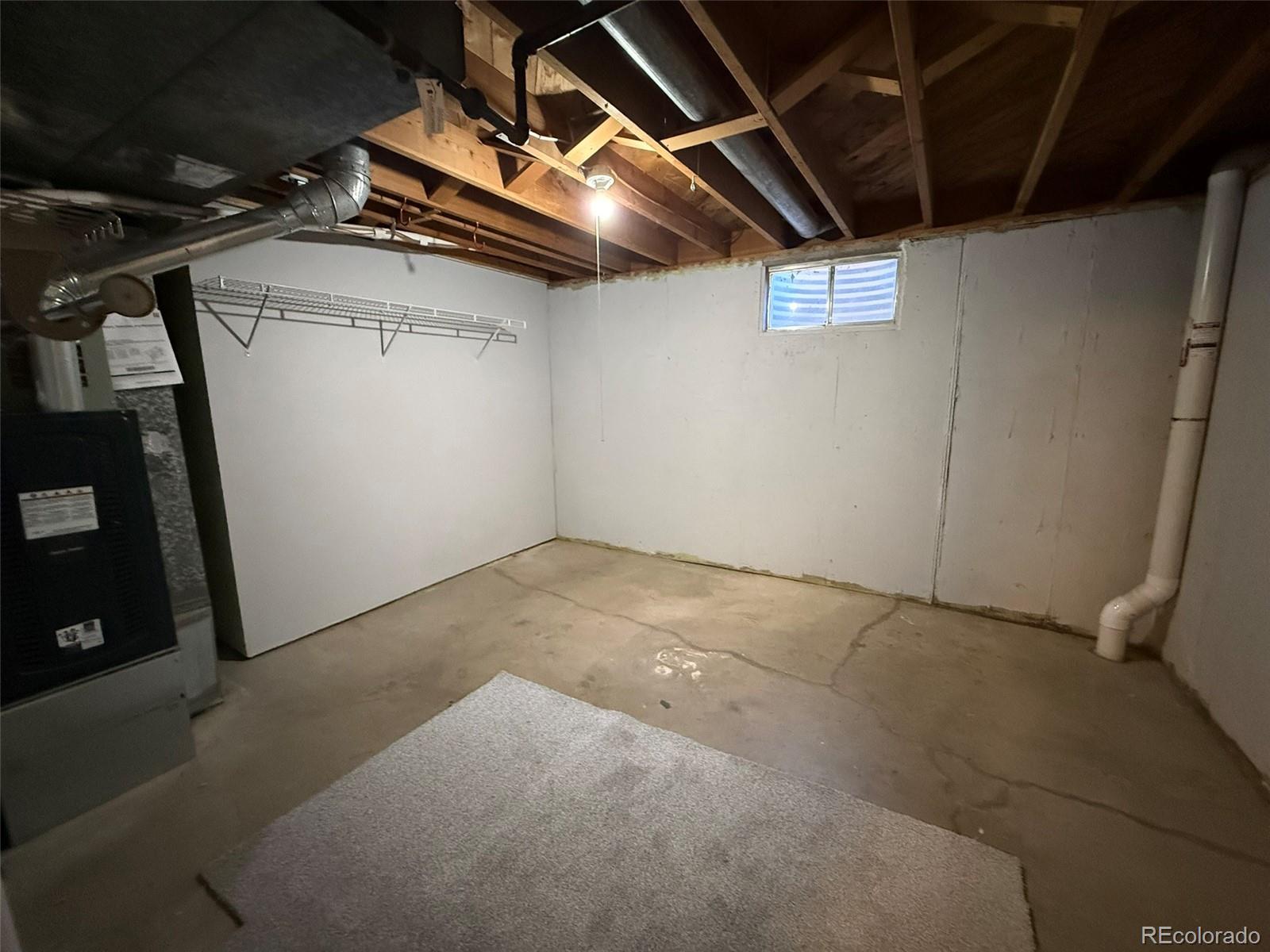 378 South Racine Street Aurora, CO 80012 - Photo 28 of 44 a view of storage and utility room