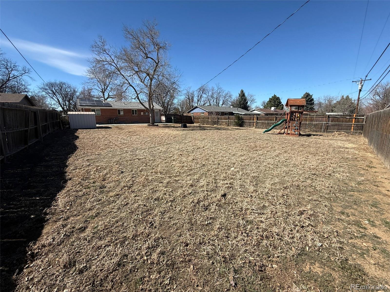 378 South Racine Street Aurora, CO 80012 - Photo 30 of 44 a view of road with trees