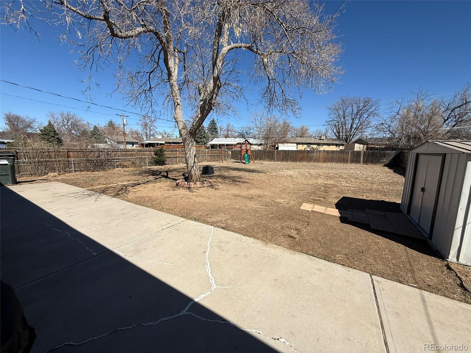 378 South Racine Street Aurora, CO 80012 - Photo 31 of 44 a view of swimming pool with outdoor seating