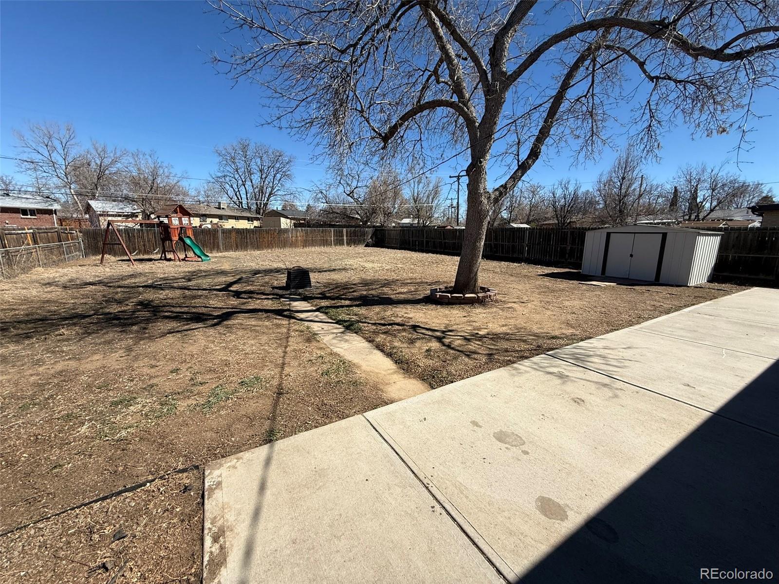 378 South Racine Street Aurora, CO 80012 - Photo 32 of 44 a view of a backyard of the house