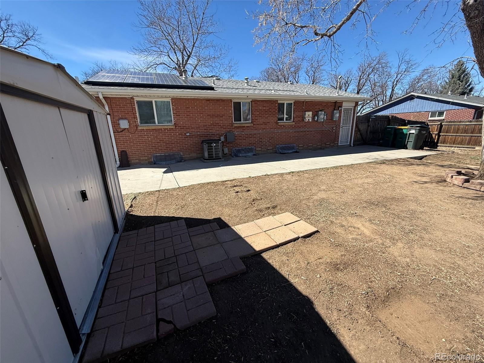 378 South Racine Street Aurora, CO 80012 - Photo 34 of 44 a front view of a house with parking area