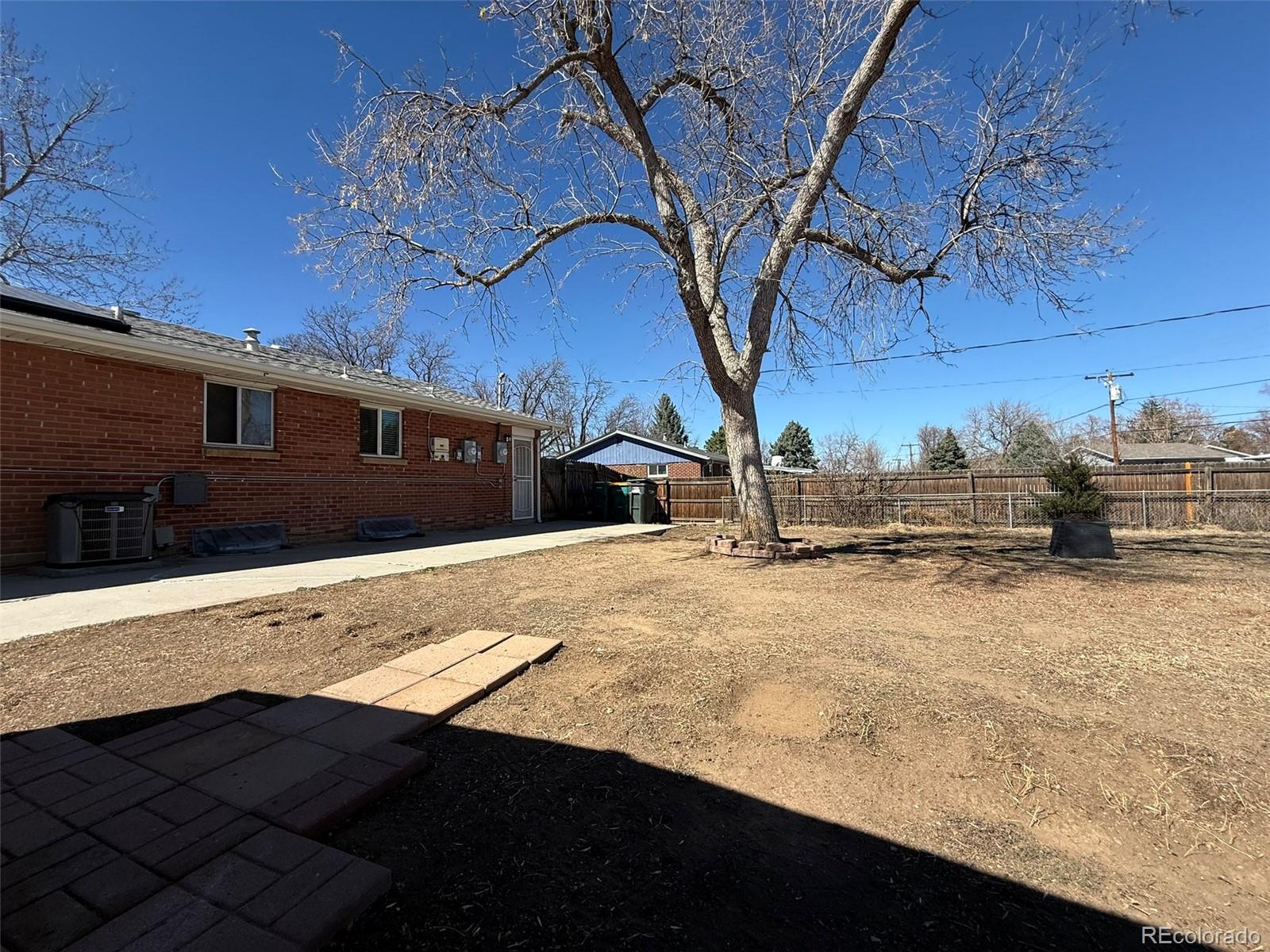378 South Racine Street Aurora, CO 80012 - Photo 36 of 44 a view of a house with snow on the road