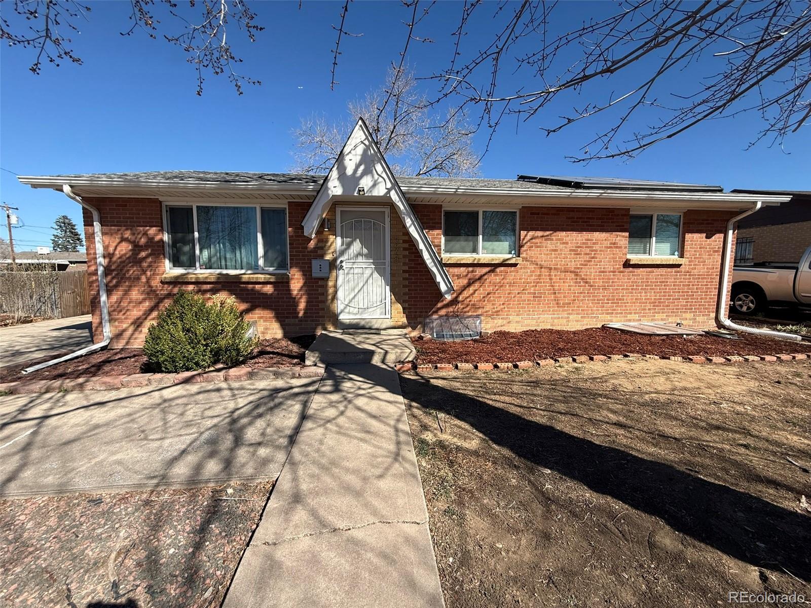 378 South Racine Street Aurora, CO 80012 - Photo 39 of 44 a house view with a backyard space