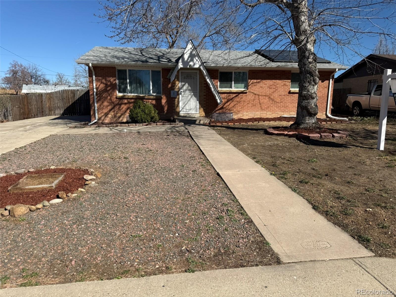 378 South Racine Street Aurora, CO 80012 - Photo 41 of 44 a view of a backyard with tv