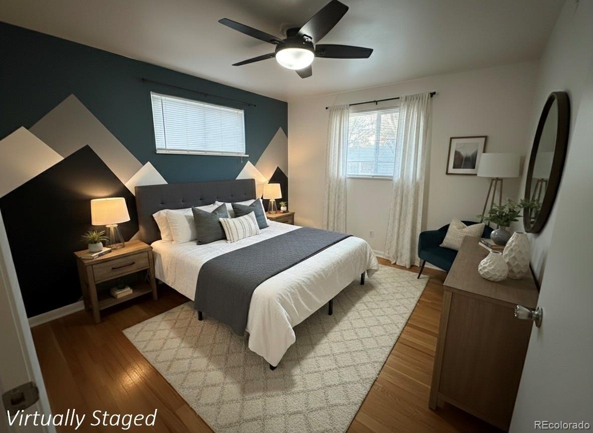 378 South Racine Street Aurora, CO 80012 - Photo 5 of 44 a bedroom with a bed and wooden floor