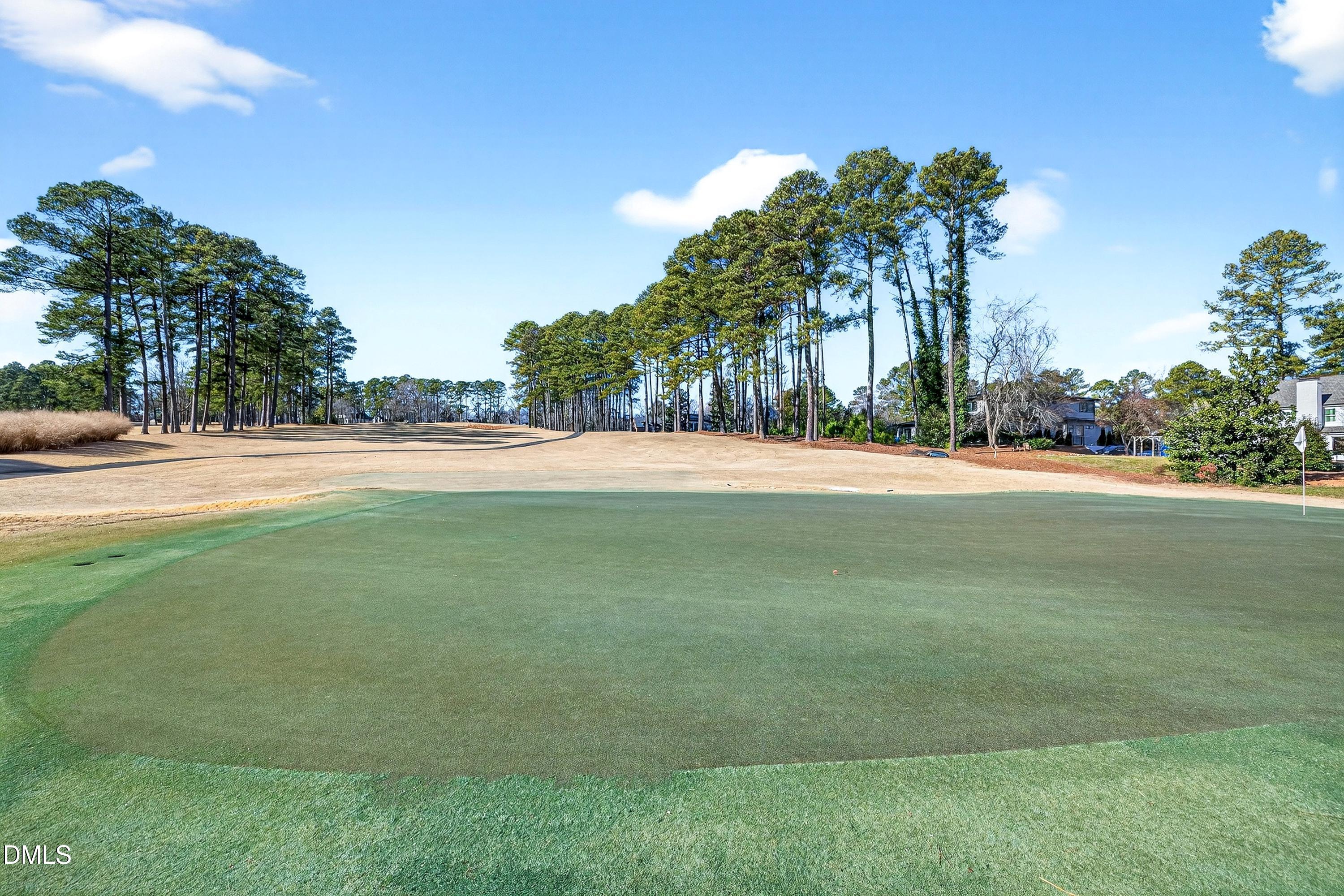 1708 Hunting Ridge Road Raleigh, NC 27615 - Photo 18 of 35 a view of a field of grass and trees