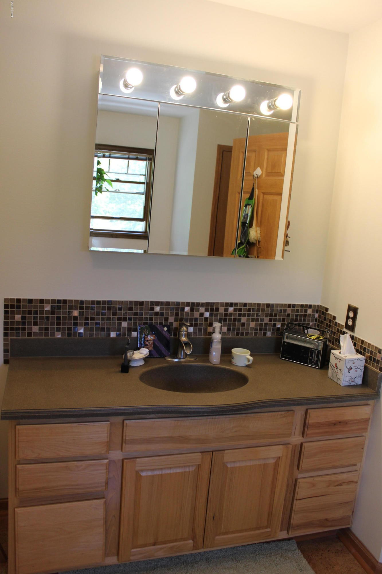 232 Maple Ridge Drive Hawley, PA 18428 - Photo 19 of 44 a bathroom with a sink and a mirror