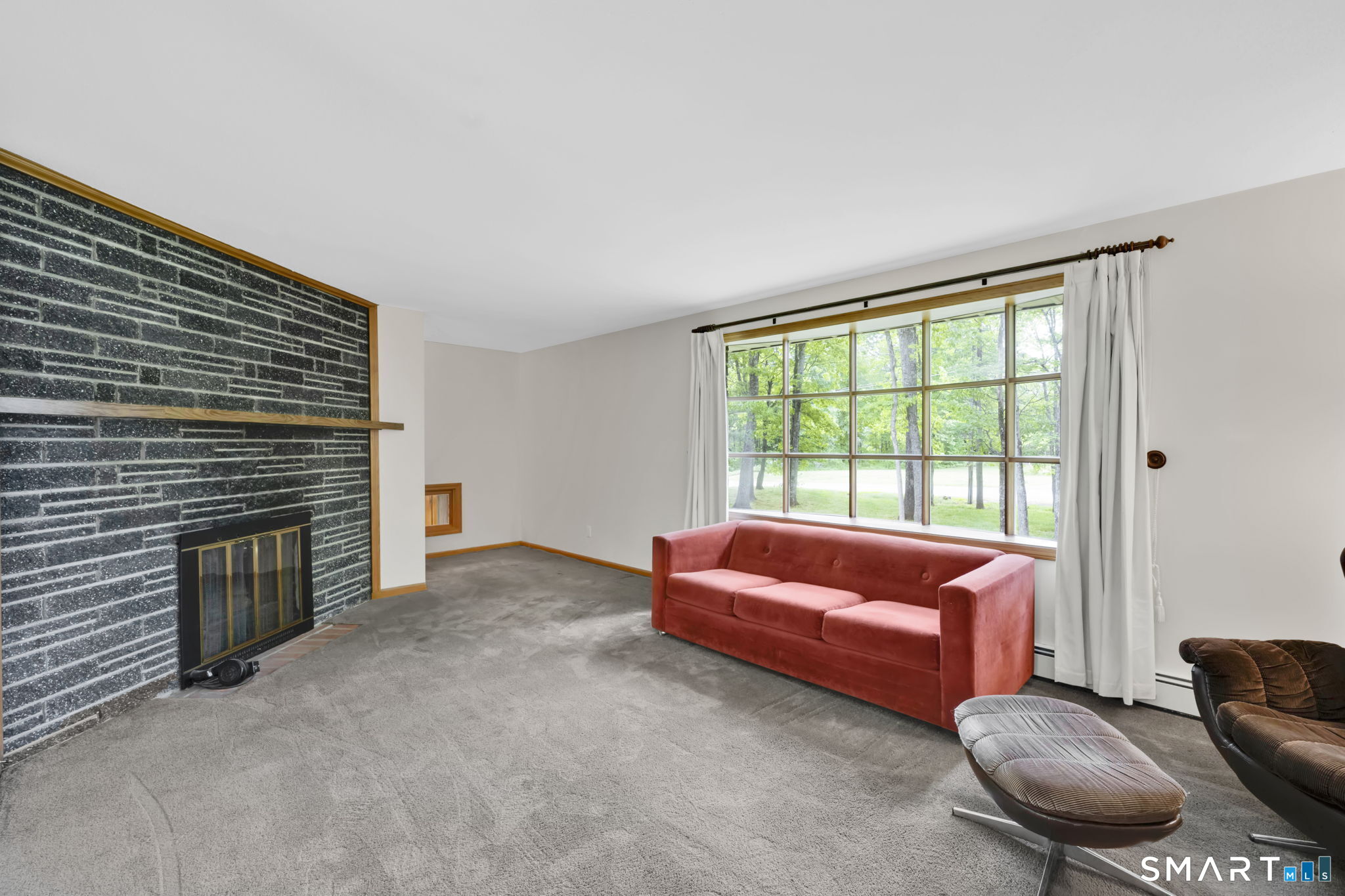 158 Notch Road Granby, CT 06035 - Photo 12 of 40 a living room with furniture and a fireplace