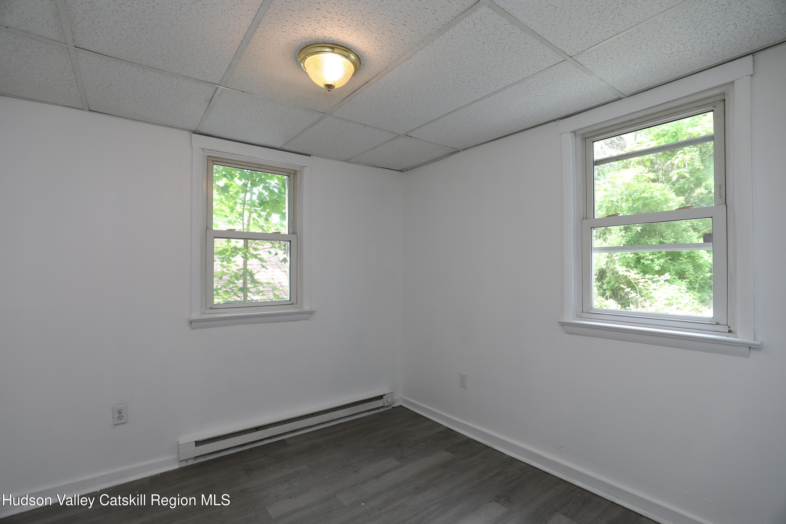 17 Rear Chapel Street, Unit 1 Ellenville, NY 12428 - Photo 6 of 11 an empty room with a window