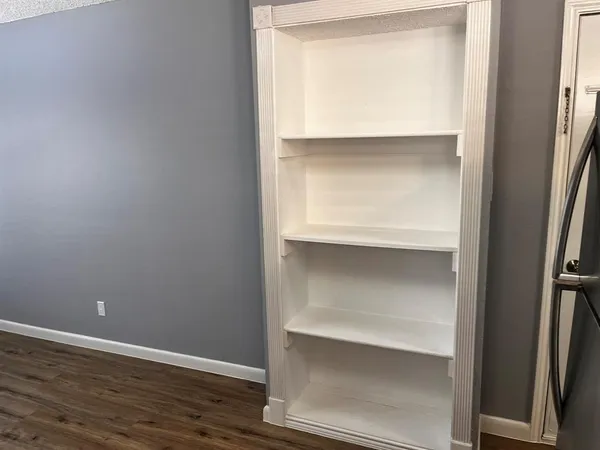 a view of an empty walk in closet