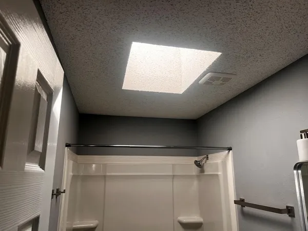 a view of walk in closet with window