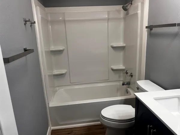 a bathroom with a sink toilet and a bathtub