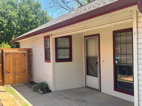 a view of a door and the house