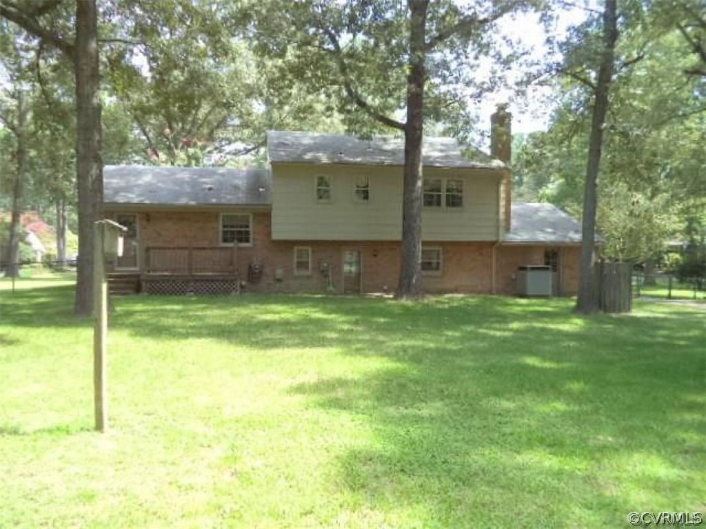 11430 Rochelle Road Chester, VA 23831 - Photo 2 of 21 a front view of a house with a garden