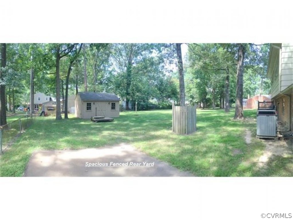 11430 Rochelle Road Chester, VA 23831 - Photo 3 of 21 a view of a backyard with large trees