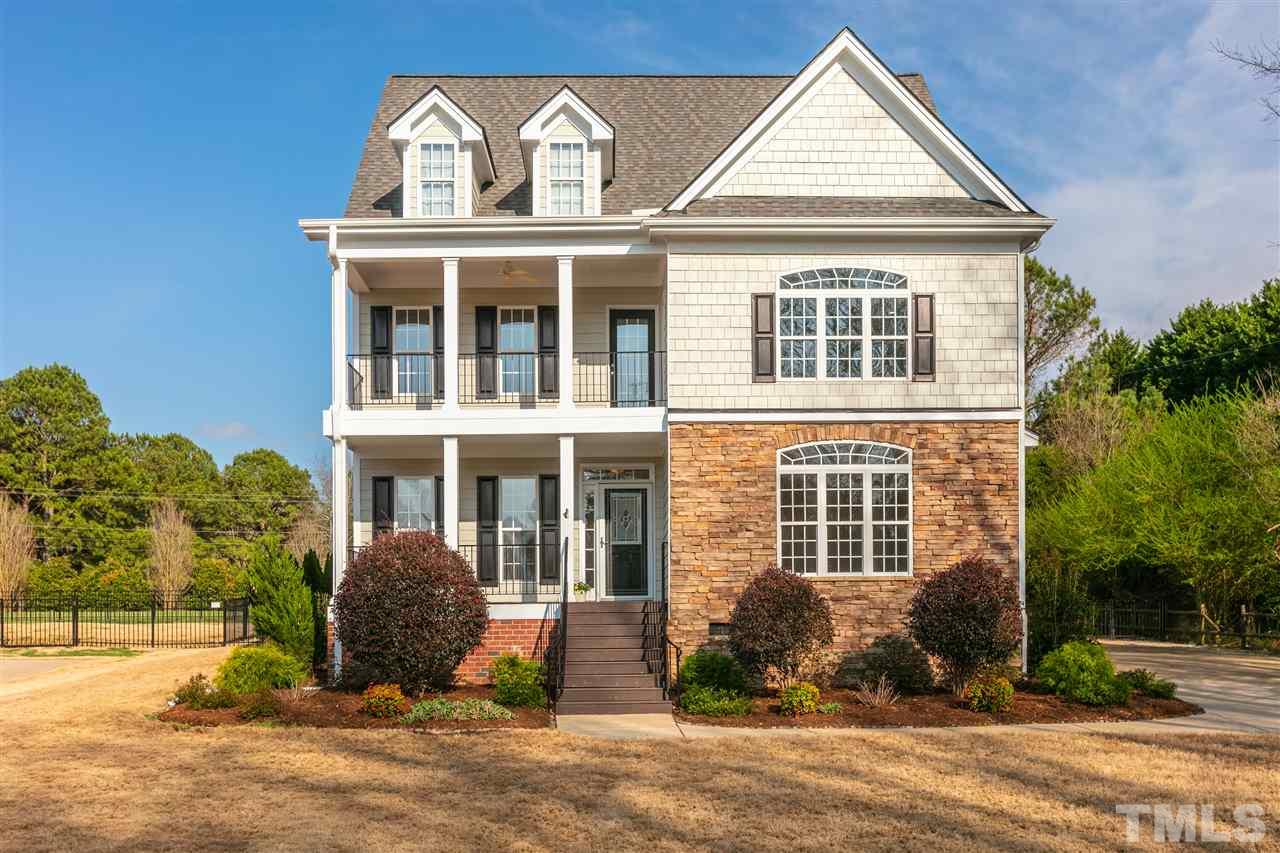 6325 Southern Charm Lane Raleigh, NC 27603 - Photo 1 of 29 Double porch front exterior overlooks community pond.