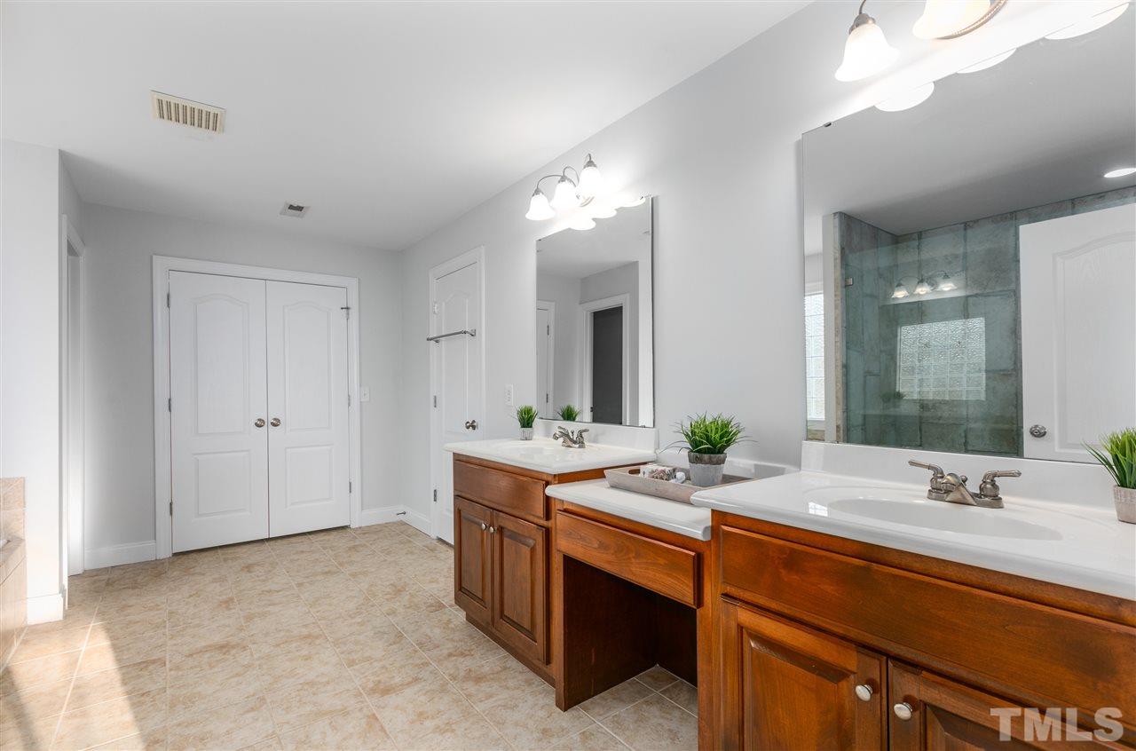6325 Southern Charm Lane Raleigh, NC 27603 - Photo 15 of 29 Dual vanity sinks and tile floors.