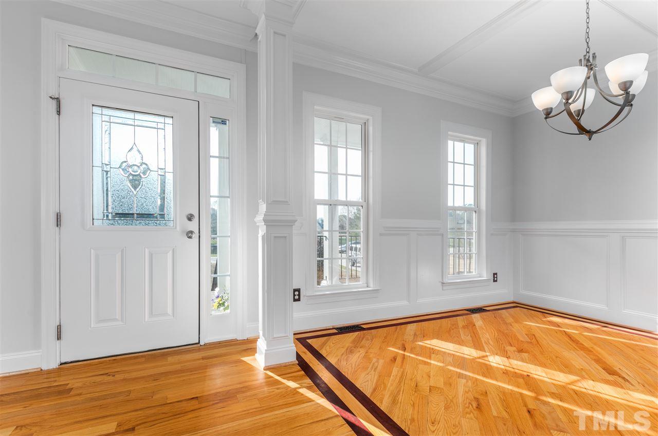 6325 Southern Charm Lane Raleigh, NC 27603 - Photo 5 of 29 Custom trim and molding accents dining room.