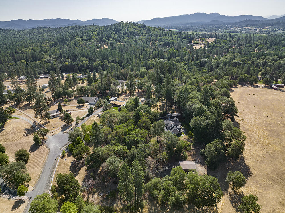 375 Oak Ranch Road Grants Pass, OR 97526 - Photo 48 of 57 an aerial view of residential house with outdoor space and trees all around