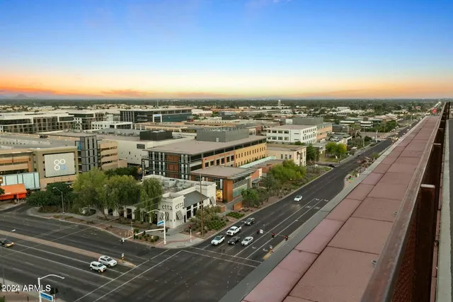 a view of a sign board with buildings