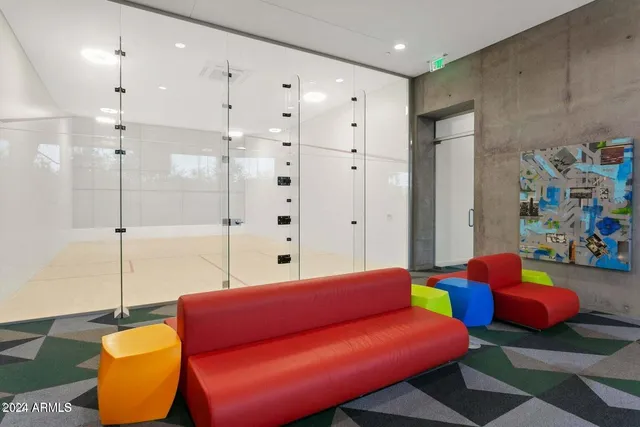 a view of a terrace with chairs and a tables