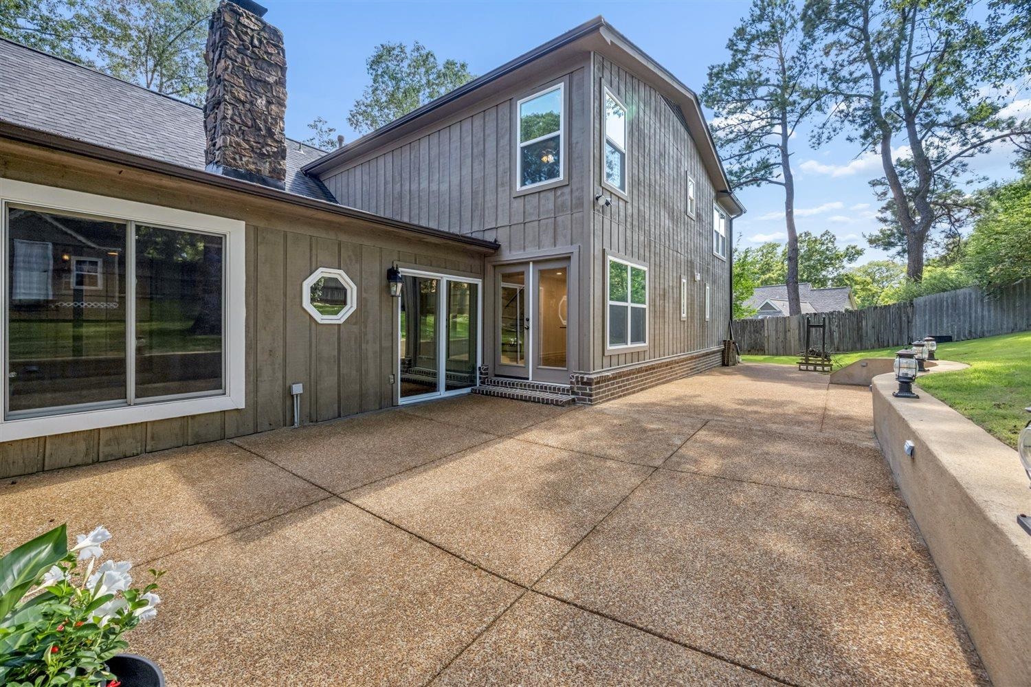 8970 Farmoor Road Germantown, TN 38139 - Photo 30 of 35 Expansive exposed aggregate patio with segmented concretework