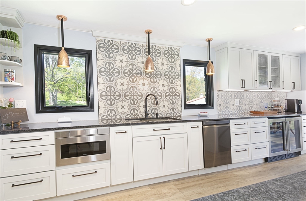 27 Old Poor Farm Road Ware, MA 01082 - Photo 19 of 42 a kitchen with granite countertop white cabinets white appliances and sink