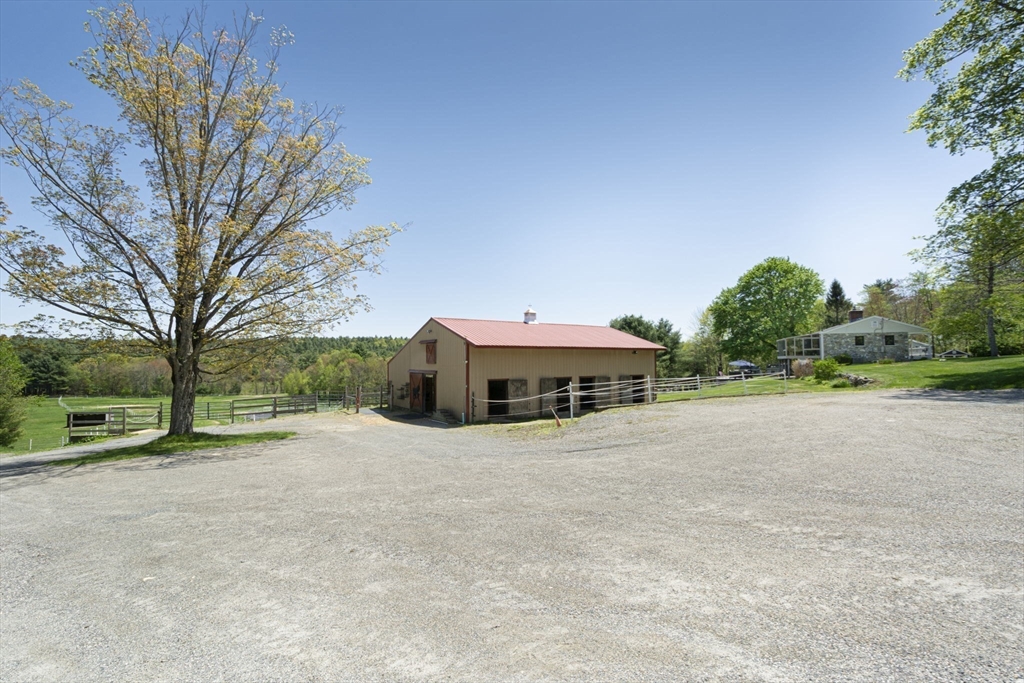 27 Old Poor Farm Road Ware, MA 01082 - Photo 5 of 42 a view of a house with a yard and large trees