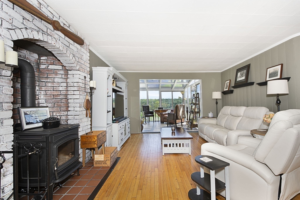 27 Old Poor Farm Road Ware, MA 01082 - Photo 7 of 42 a living room with furniture and a fireplace