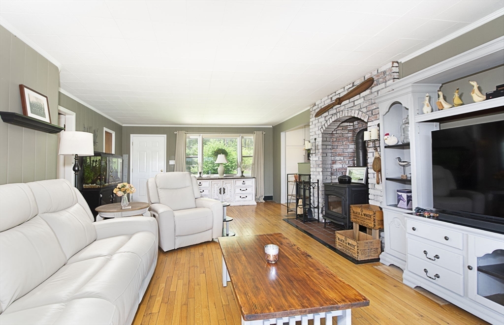 27 Old Poor Farm Road Ware, MA 01082 - Photo 9 of 42 a living room with furniture fireplace and flat screen tv