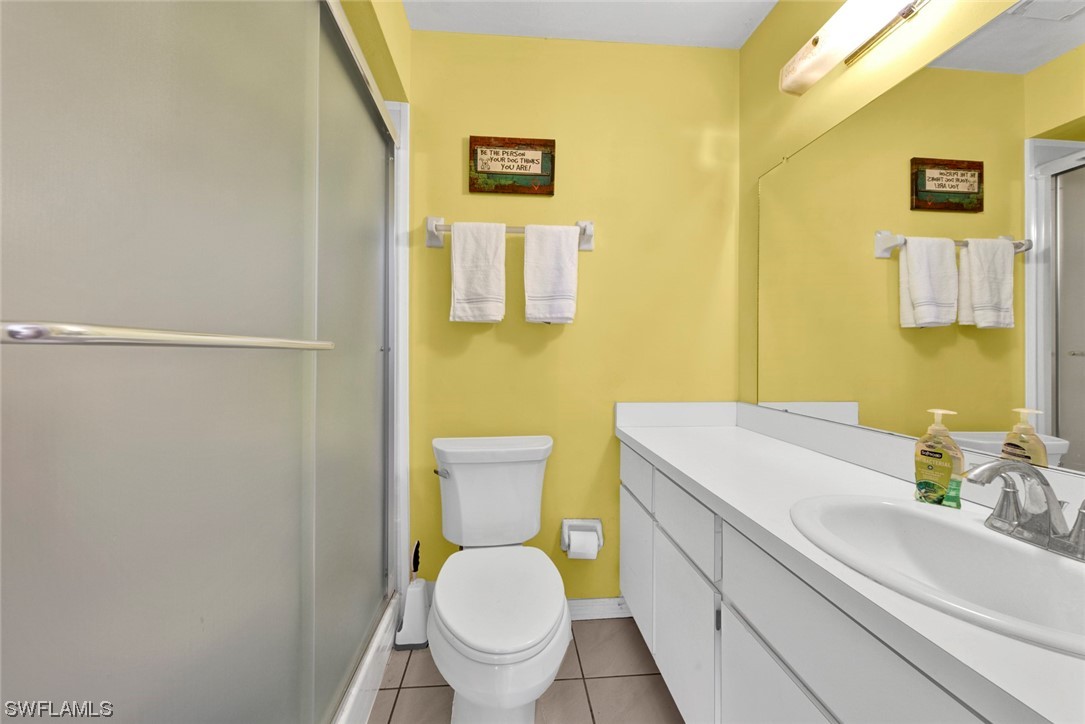 7234 Myrtle Road Fort Myers, FL 33967 - Photo 14 of 32 a bathroom with a sink and a toilet