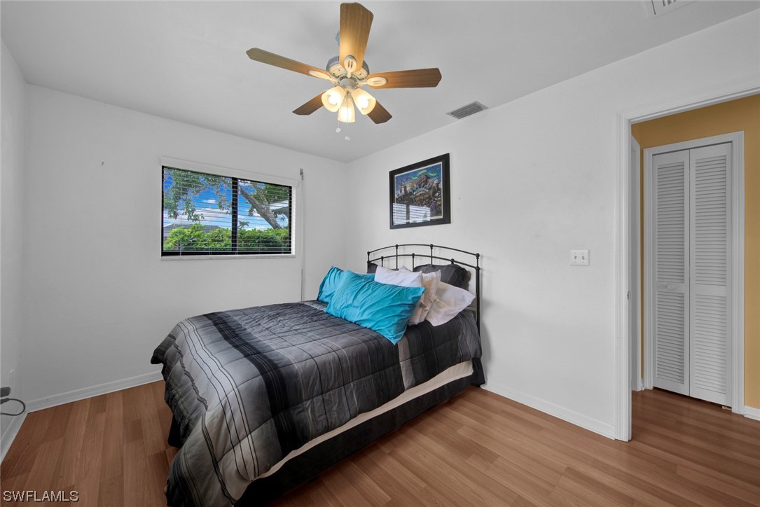 7234 Myrtle Road Fort Myers, FL 33967 - Photo 16 of 32 a bedroom with a bed and a window