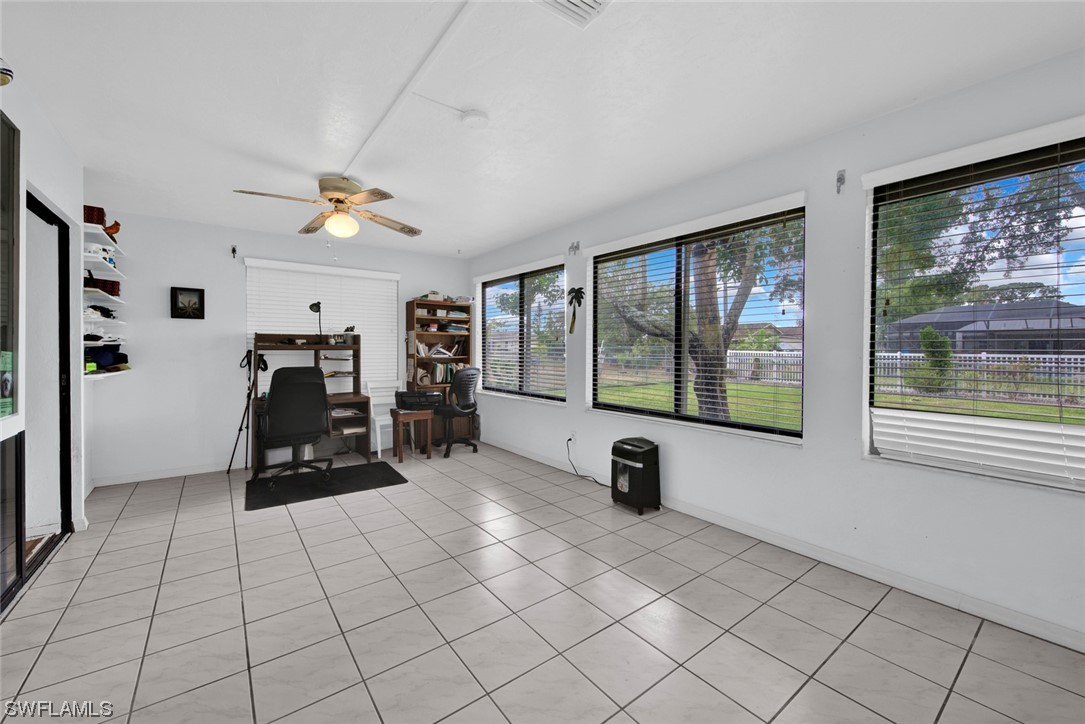 7234 Myrtle Road Fort Myers, FL 33967 - Photo 20 of 32 a living room with furniture and a flat screen tv
