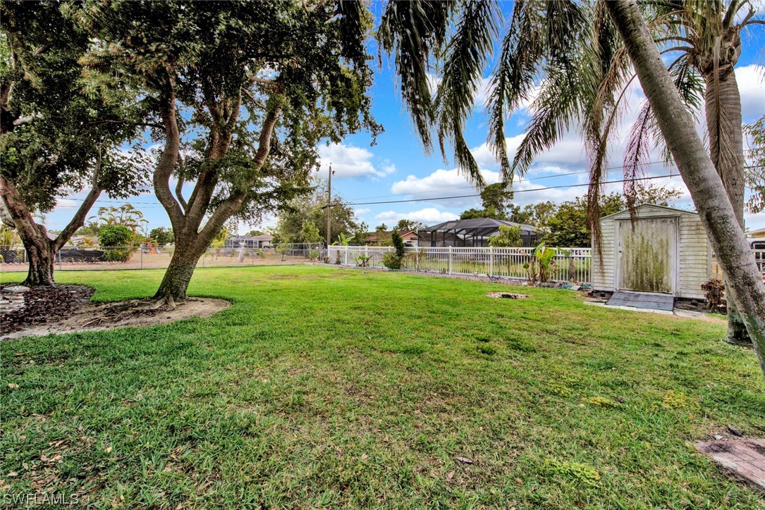 7234 Myrtle Road Fort Myers, FL 33967 - Photo 26 of 32 a view of a yard with palm trees