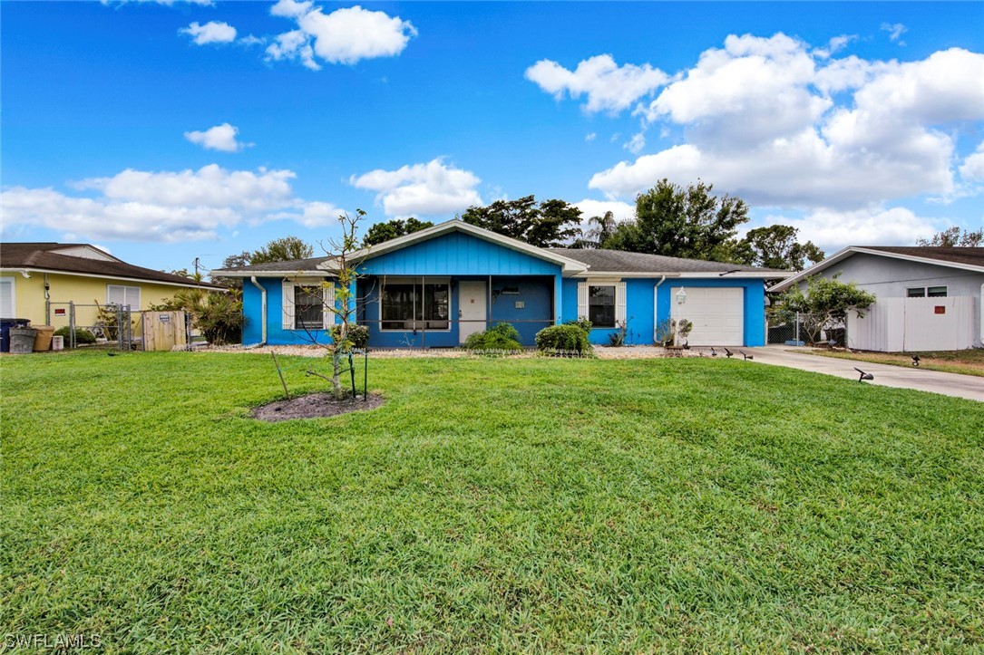 7234 Myrtle Road Fort Myers, FL 33967 - Photo 29 of 32 a front view of a house with garden