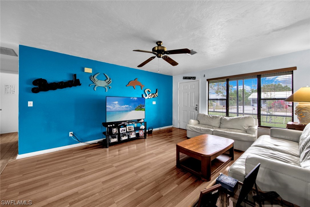 7234 Myrtle Road Fort Myers, FL 33967 - Photo 3 of 32 a living room with furniture and a flat screen tv