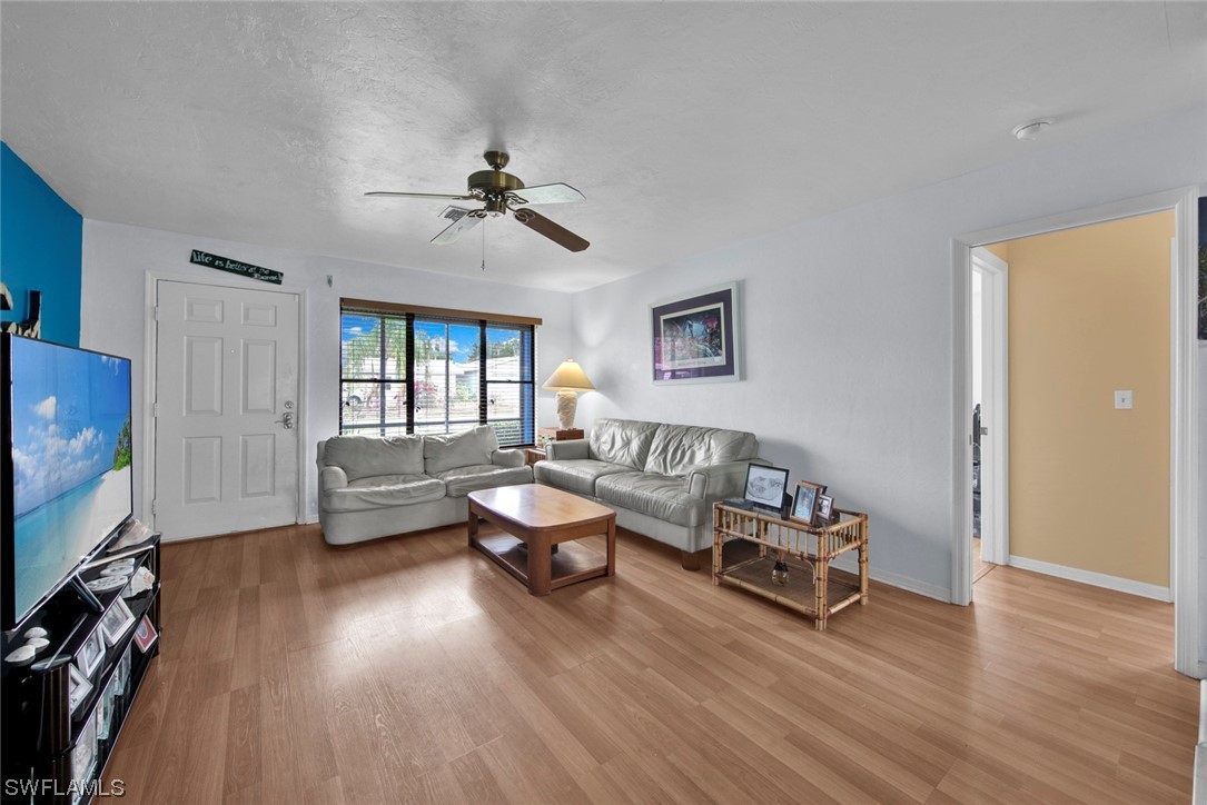 7234 Myrtle Road Fort Myers, FL 33967 - Photo 4 of 32 a living room with furniture and a flat screen tv