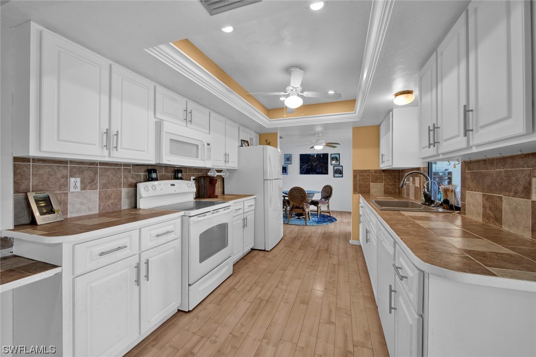 7234 Myrtle Road Fort Myers, FL 33967 - Photo 9 of 32 a kitchen with kitchen island granite countertop lots of counter top space and cabinets