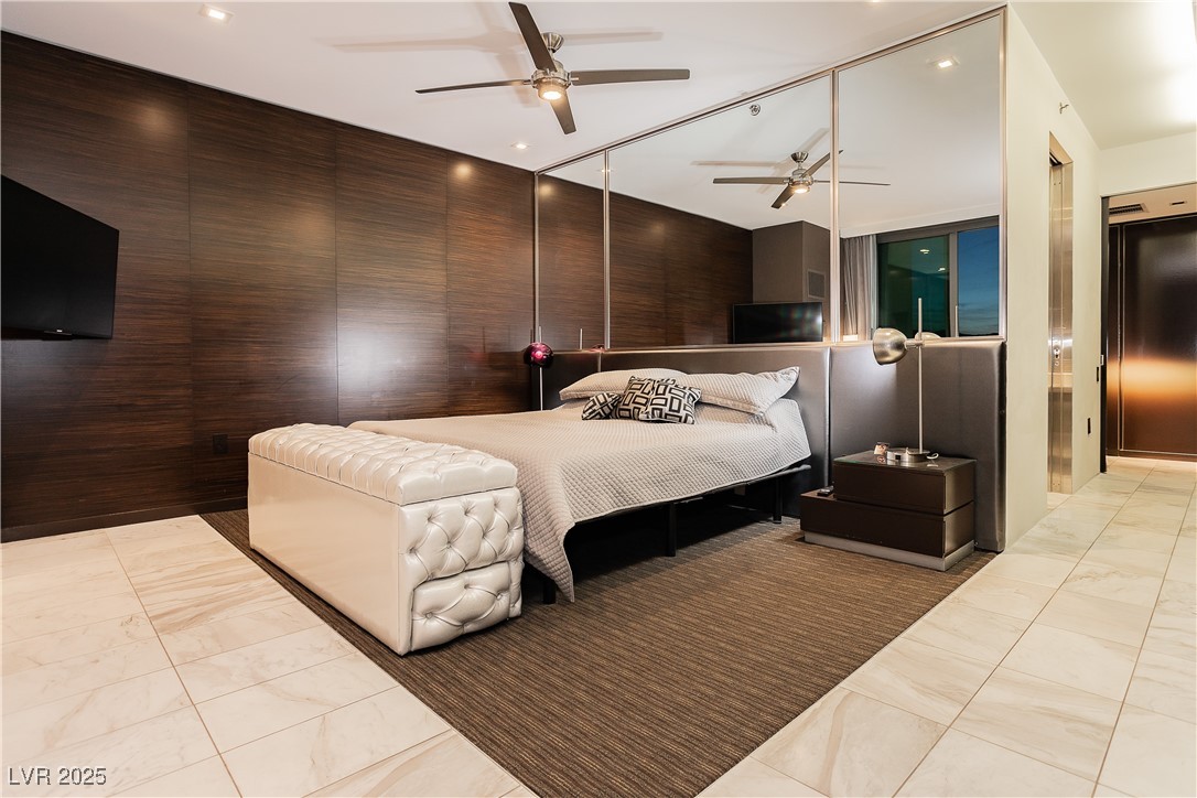 4381 West Flamingo Road, Unit 53321 Las Vegas, NV 89103 - Photo 23 of 41 Bedroom with ceiling fan, elevator, recessed lighting, and light tile patterned floors