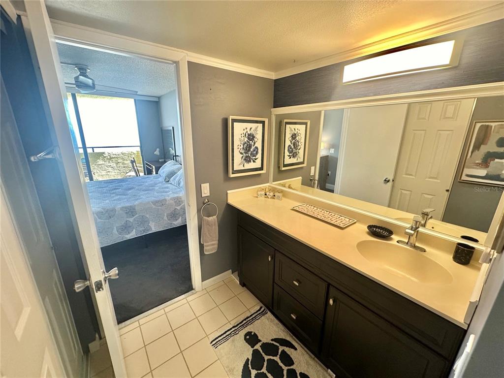 6009 Sea Ranch Drive, Unit 704 Hudson, FL 34667 - Photo 16 of 57 a spacious bathroom with a sink double vanity