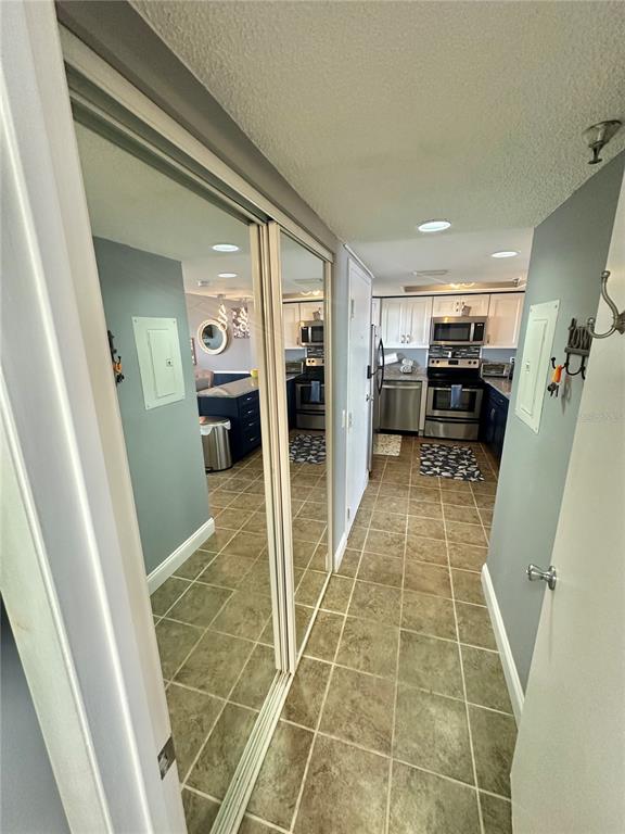 6009 Sea Ranch Drive, Unit 704 Hudson, FL 34667 - Photo 18 of 57 a bathroom with a sink a toilet and a shower