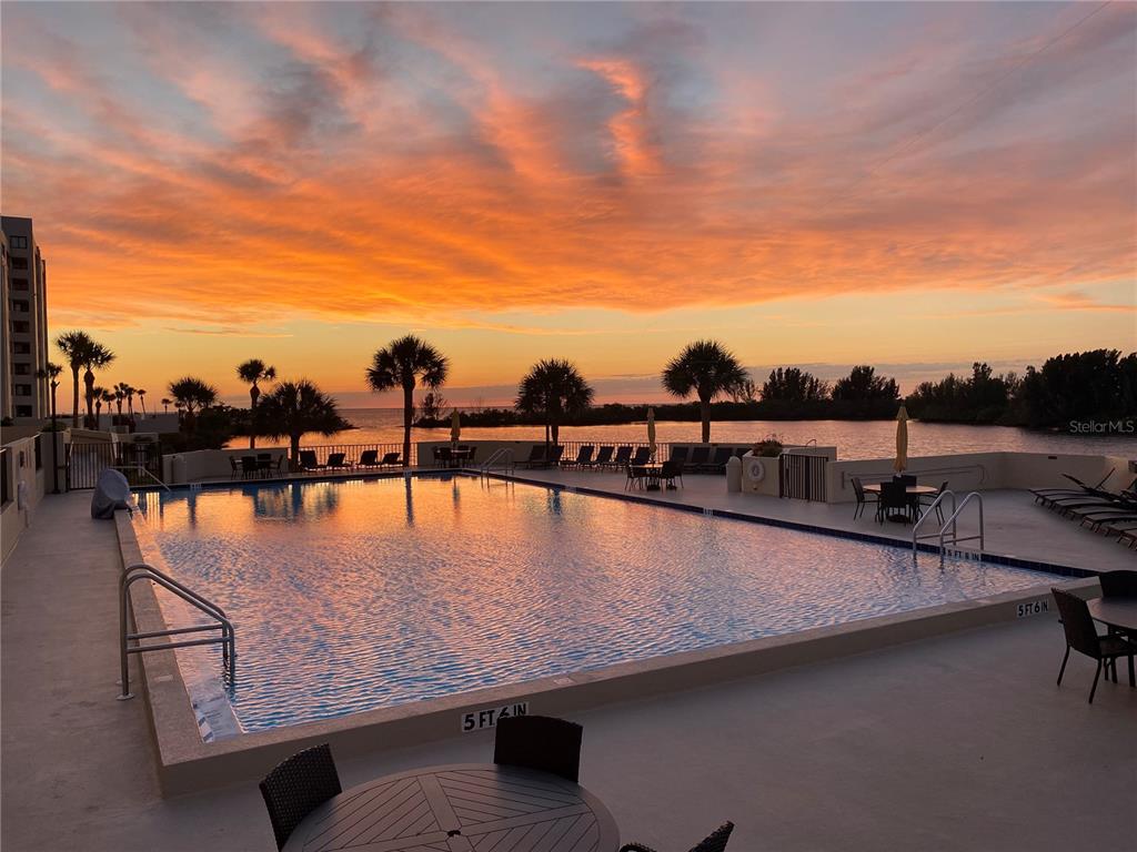 6009 Sea Ranch Drive, Unit 704 Hudson, FL 34667 - Photo 34 of 57 a view of swimming pool with outdoor seating