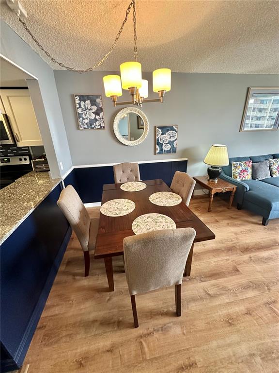 6009 Sea Ranch Drive, Unit 704 Hudson, FL 34667 - Photo 7 of 57 a view of a dining room with furniture