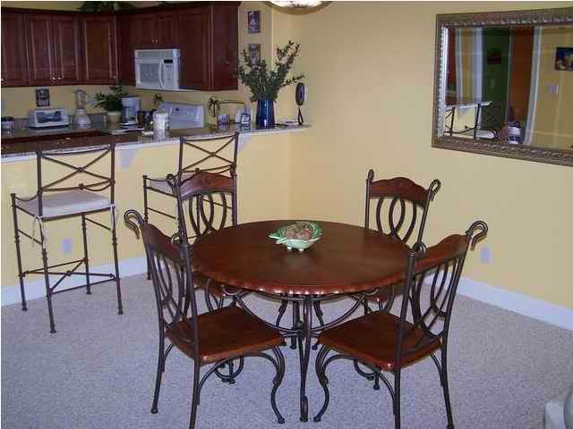 10519 Front Beach Road, Unit 2201 Panama City Beach, FL 32408 - Photo 2 of 10 a view of a dining room with furniture