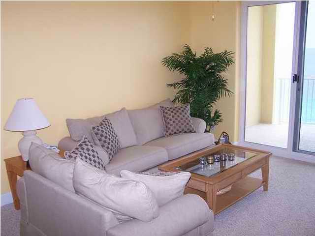 10519 Front Beach Road, Unit 2201 Panama City Beach, FL 32408 - Photo 4 of 10 a living room with furniture and a potted plant