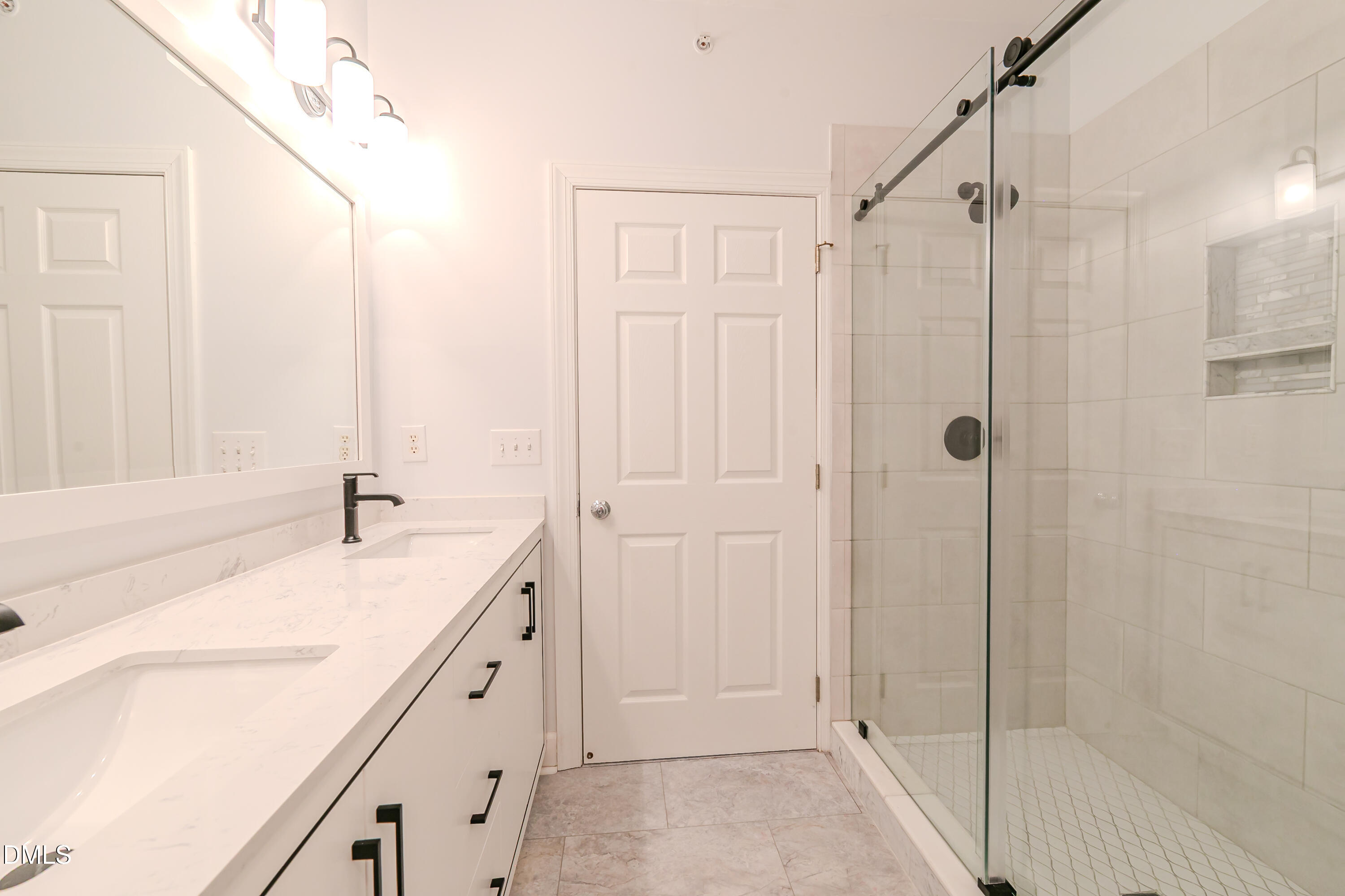 116 Northbrook Drive, Unit 305 Raleigh, NC 27609 - Photo 36 of 43 a bathroom with a granite countertop sink and shower