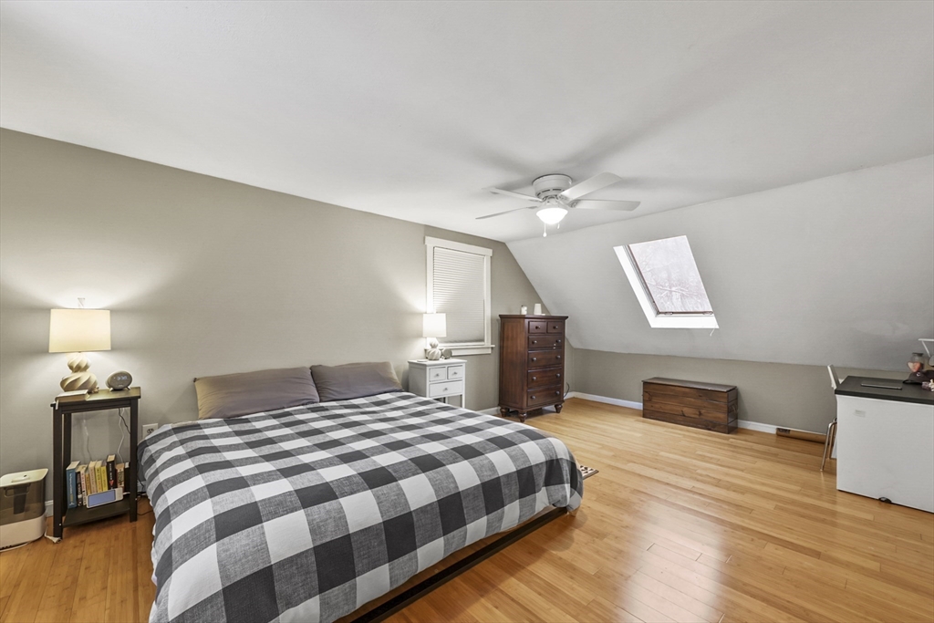 135 Conant Road Nashua, NH 03062 - Photo 21 of 40 a bedroom with a bed and wooden floor