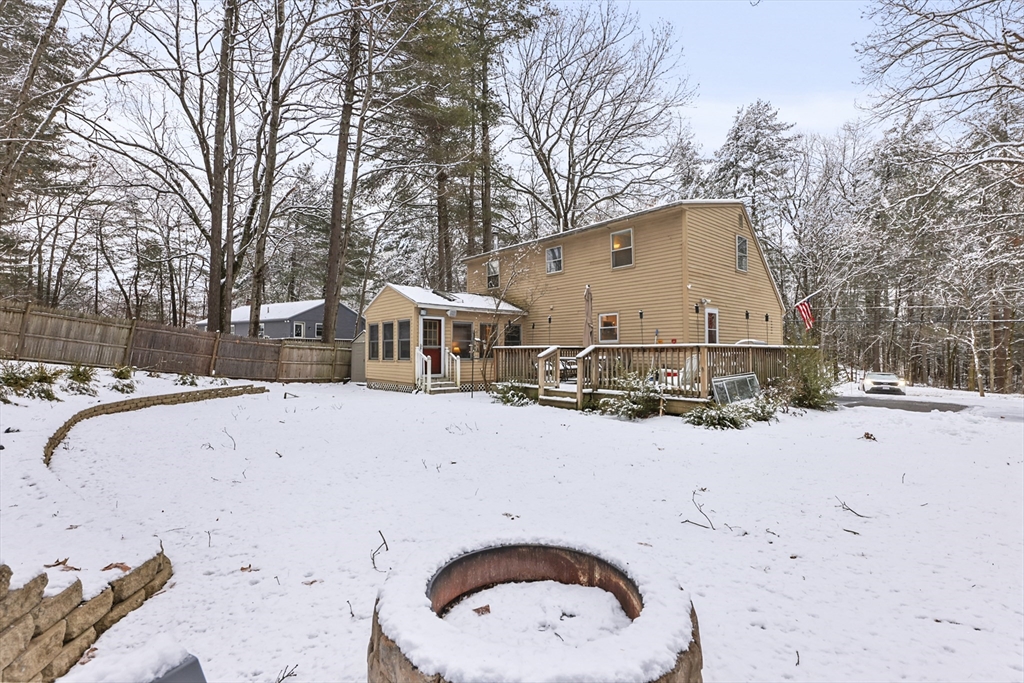 135 Conant Road Nashua, NH 03062 - Photo 38 of 40 a front view of a house with a yard covered in snow